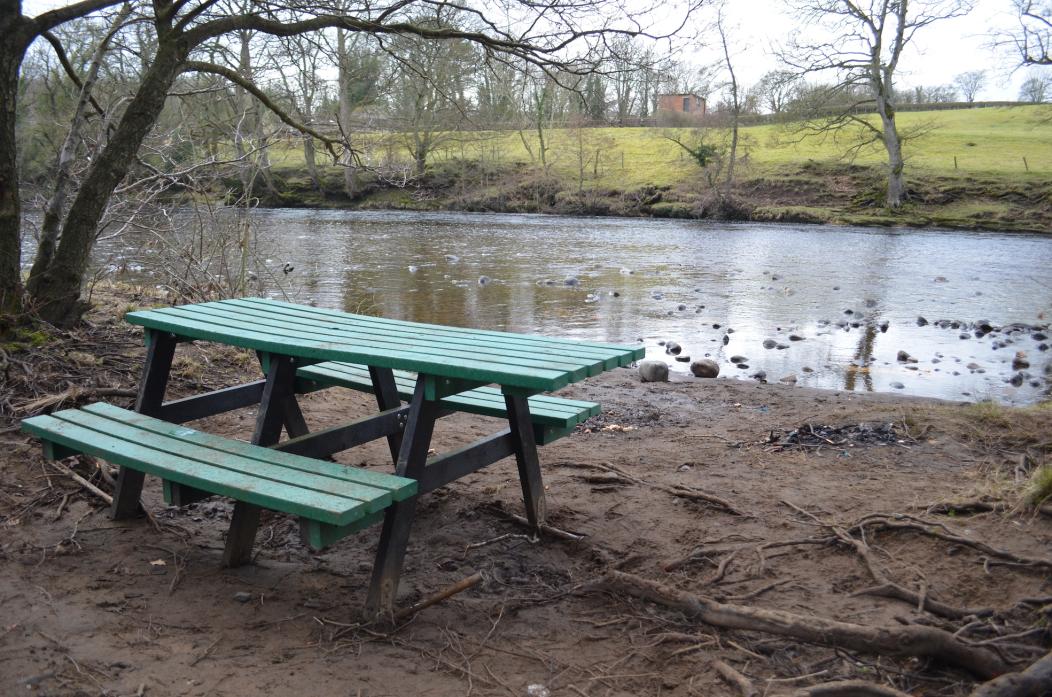 RELOCATED: The bench which was ripped from the picnic site and moved to the riverside