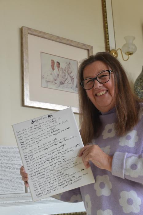 STILL SMILING: Stylist Dennie Pasion with a poem she wrote about Siegfried and Roy based on her experience working with them in the 1980s				   TM pic