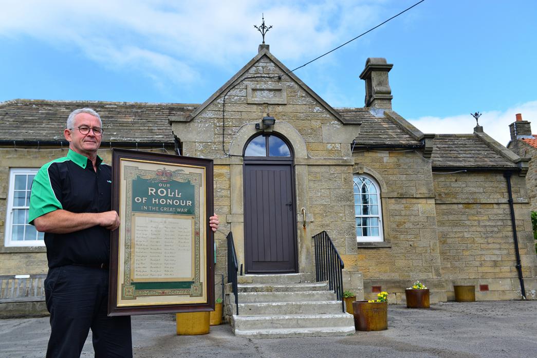 PLENTY GOING ON: Stainton Village Hall committee member Tam Smith with the roll of honour. He is asking people to get in touch with information about those named on the document