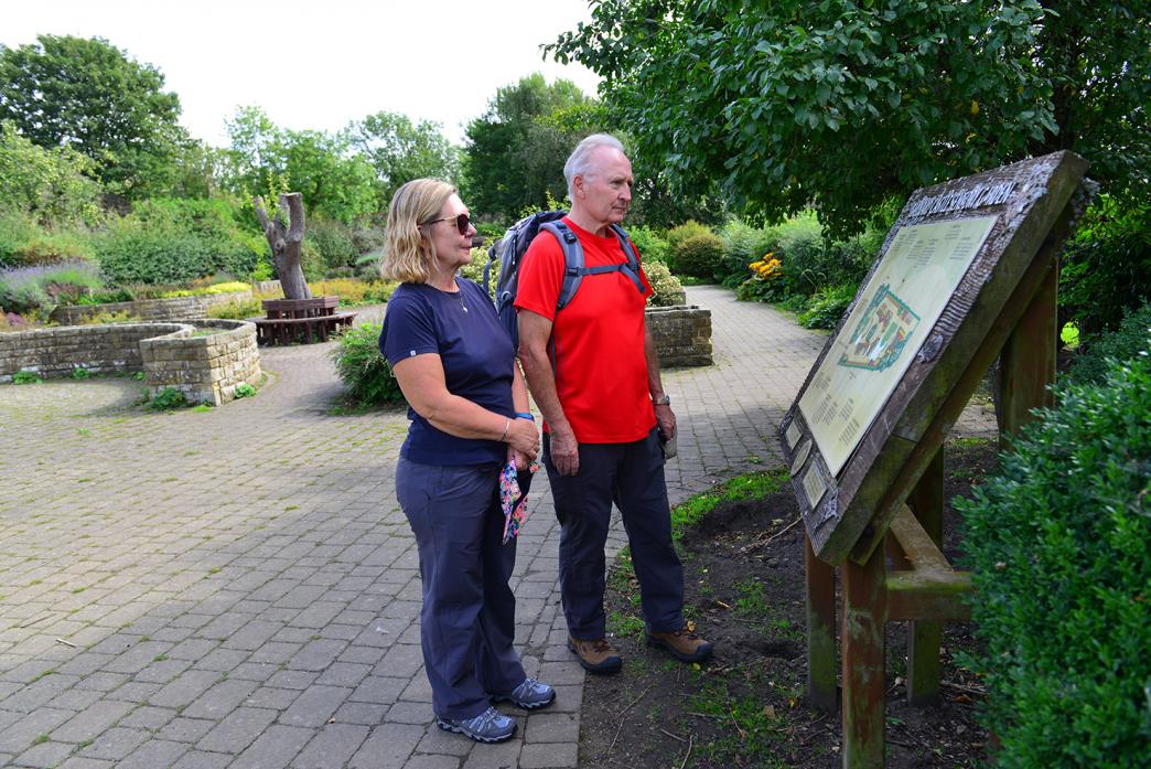 TOWN VISITORS: Caroline and Ian Artingstoll examine the interpretation board at Barnard Castle's sensory garden