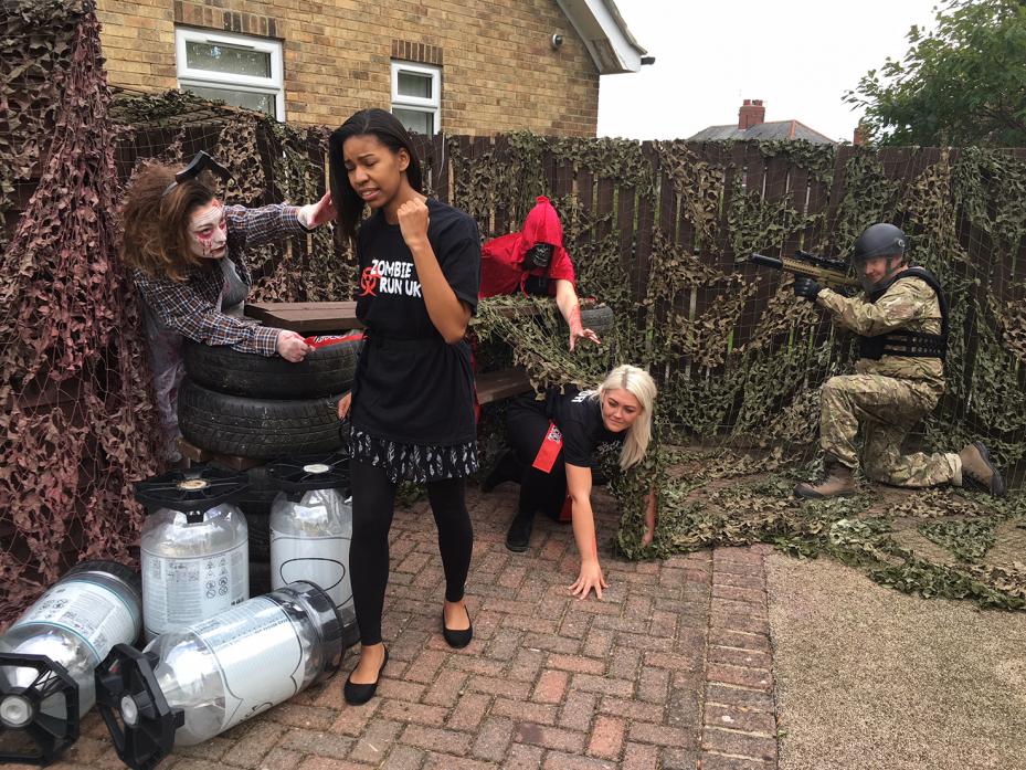 UNDER ATTACK: Selma Suleman aims to evade capture from zombies Jo Wallis, Lyndsay Barnes and Milly Toner