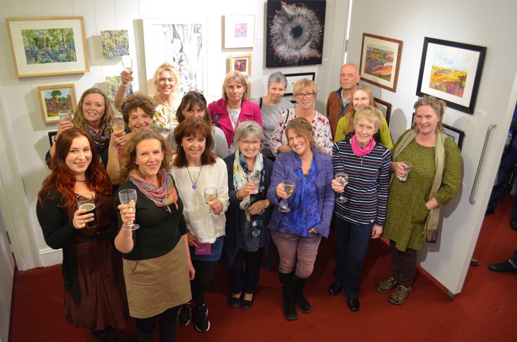 CHEERS: Members of Teesdale ArtNet raise a glass at the preview of their exhibition at The Witham