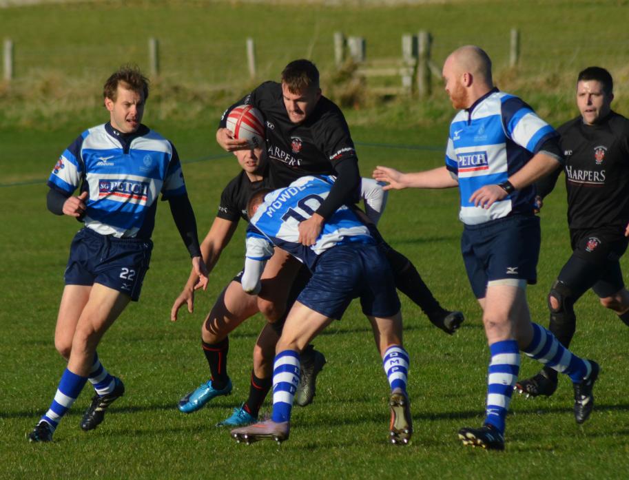 TOUGH GOING: Barnard Castle II stand-off Adam Kicks is lifted off his feet by the Mowden Park tackler