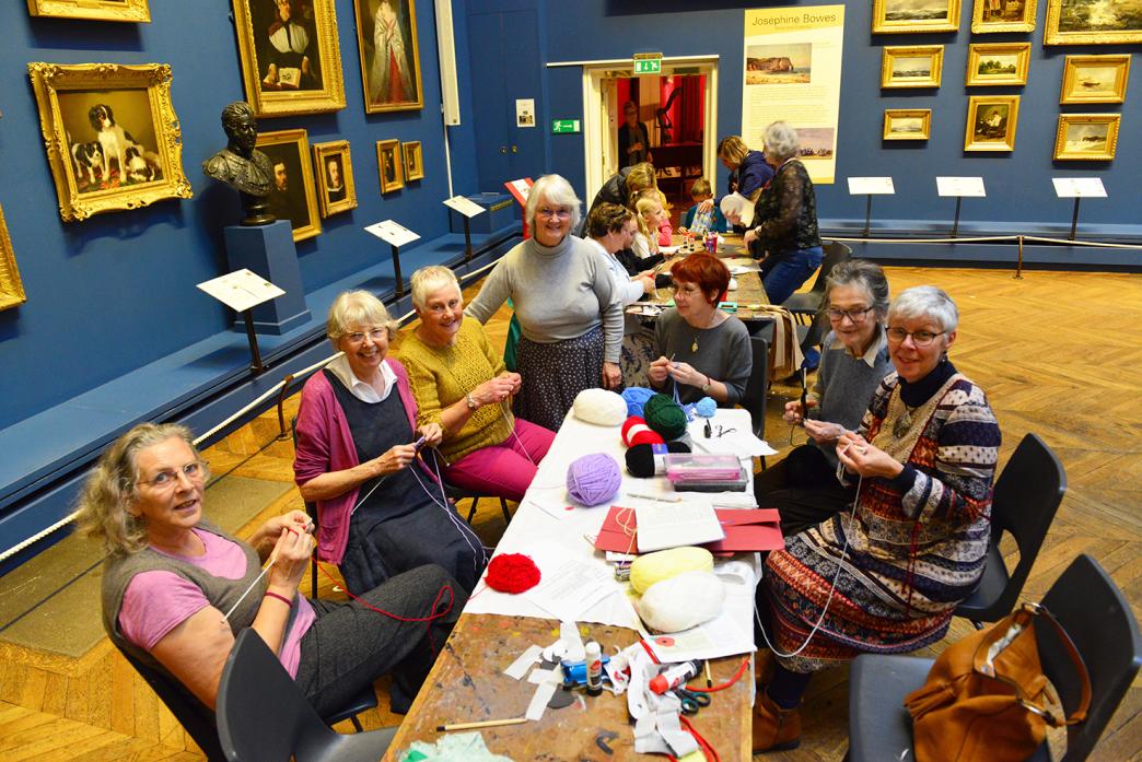 GOOD DEED: Judith Phillips, from The Bowes Museum’s First World  War project, keeps  Kathy Burrage, Jennie Lee, Myra Atkinson, Moira Elliott, Elizabeth Gott and Clair Williams company while they knit away