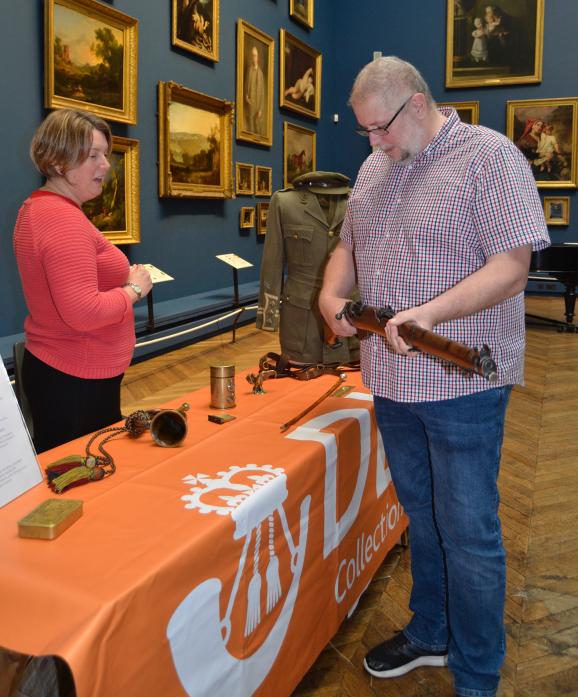 HANDS ON: Visitor Andrew Brewerton gets to grips with a World War One rifle with one of the DLI’s learning support officers Carolyn Waterworth