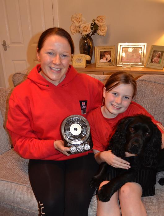 ROLE MODEL: Lainey Hunt with her World Drug Free Powerlifting Championship trophy with daughter Megan