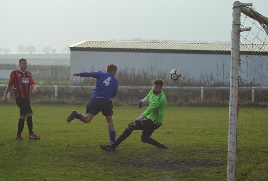 HONOURS EVEN: Evenwood Town’s Chris Howe wheels away in celebration after levelling the score 2-2 in the game against Wolsingham on Saturday