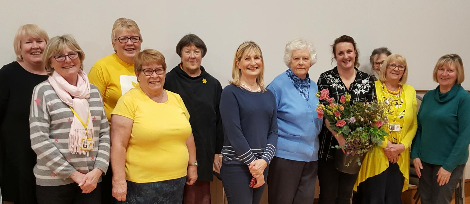 VITAL FUNDRAISING: Members of the group with Sarah Meeson, who is pictured with the flowers