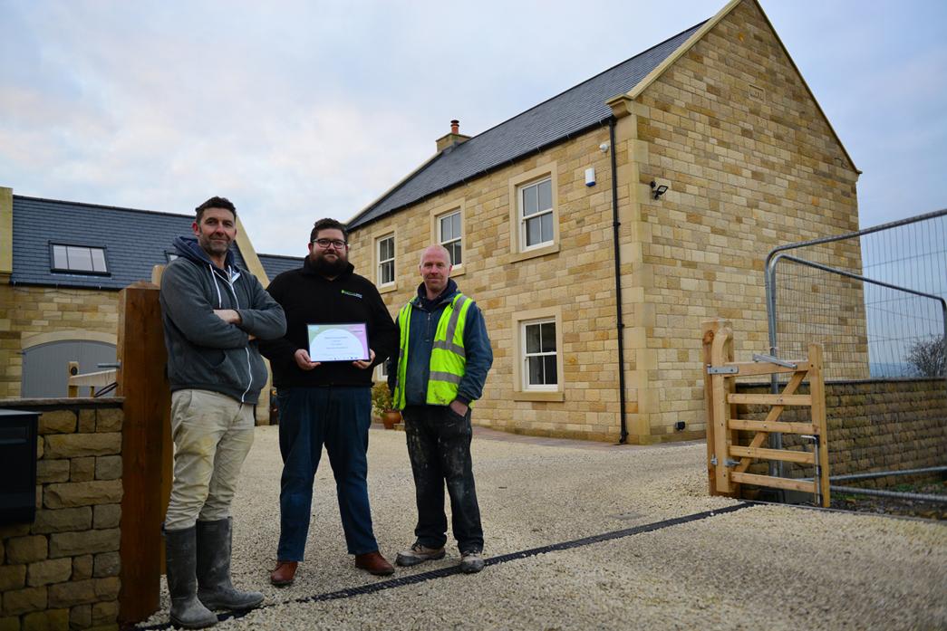 DELIGHT: Ashley Tunstall, Matthew Lee and Liam Glasper with the environment award they received for a new build in Low Etherley TM pic
