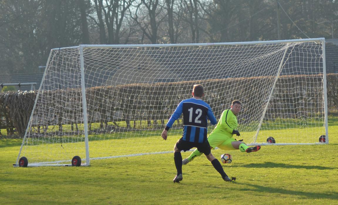 ON TARGET: Wear Valley’s Jason Brasauskus slots the ball under the approaching Bowes keeper Richard Borrowdale for the opener in Saturday’s league match