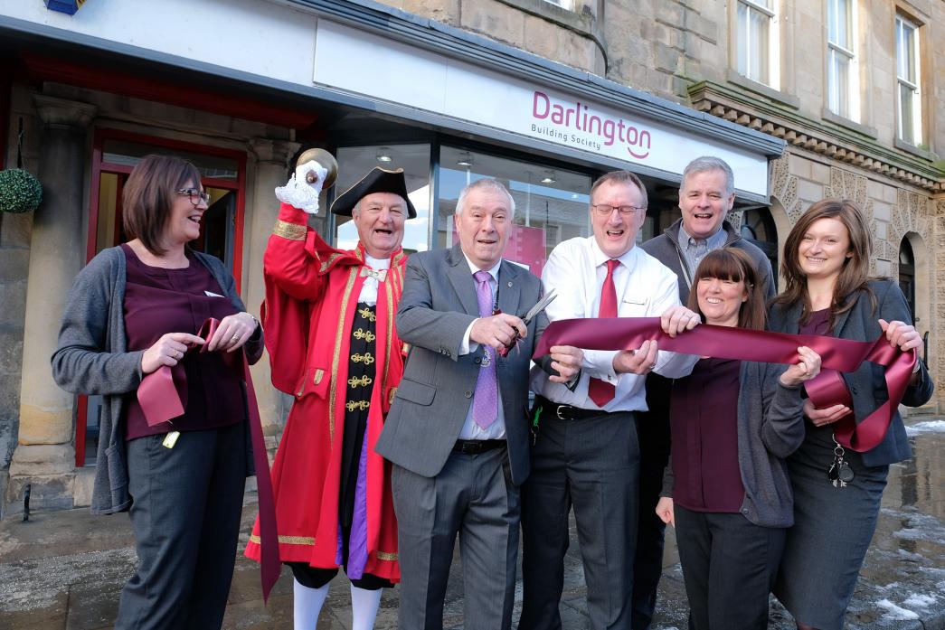 NEW LOOK: Bob Garton, president of Teesdale Lions Club, cuts the ribbon to unveil the new-look Darlington Building Society branch in Barnard Castle