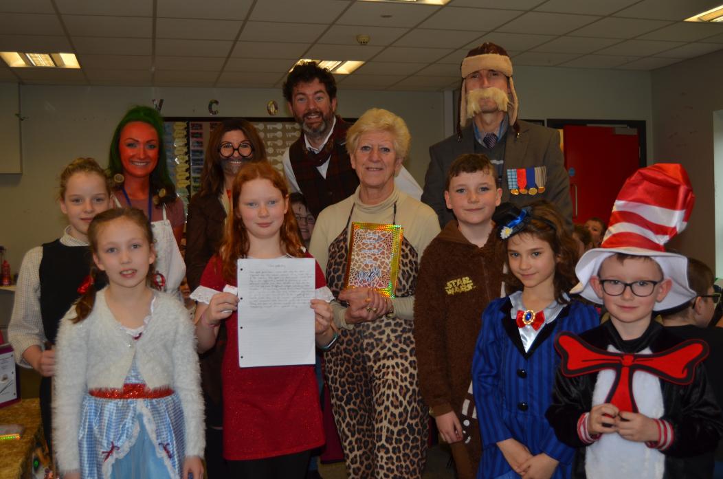 SPELL ON YOU: Local author Kay Wilson gave talks to all the children at Green Lane School. She is pictured centre with student council member Madie Ainsley and other students and teachers who dressed up for the occasion.