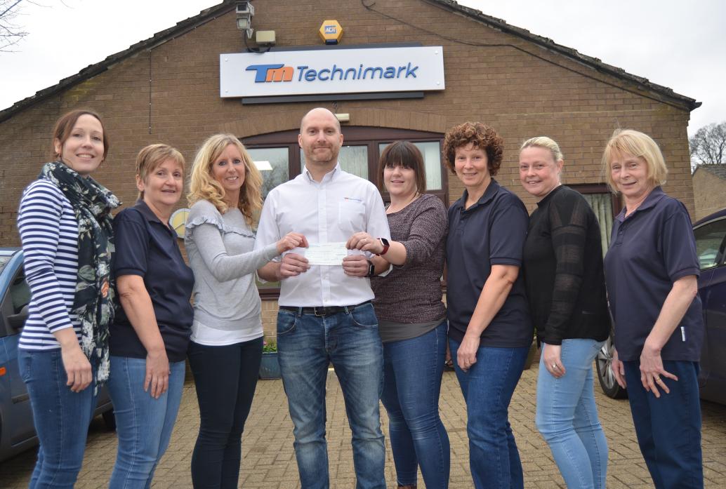 HEARTFELT: Staff at Technimark raised £500 for Wesley Terrace play area renovation fund. Seen with the cash are Grace Crawford, Sue Gowland, Faye Docherty, Stephen Shaw, Ali Collinson, Bridget Marshall, Michelle Mitchell and Brenda Robinson