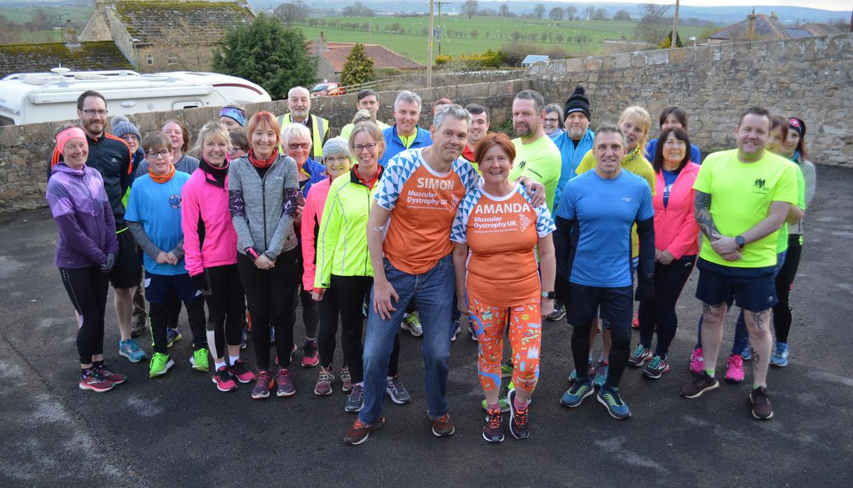 Simon and Amanda Pettitt with runners who turned out for last week’s fundraiser.