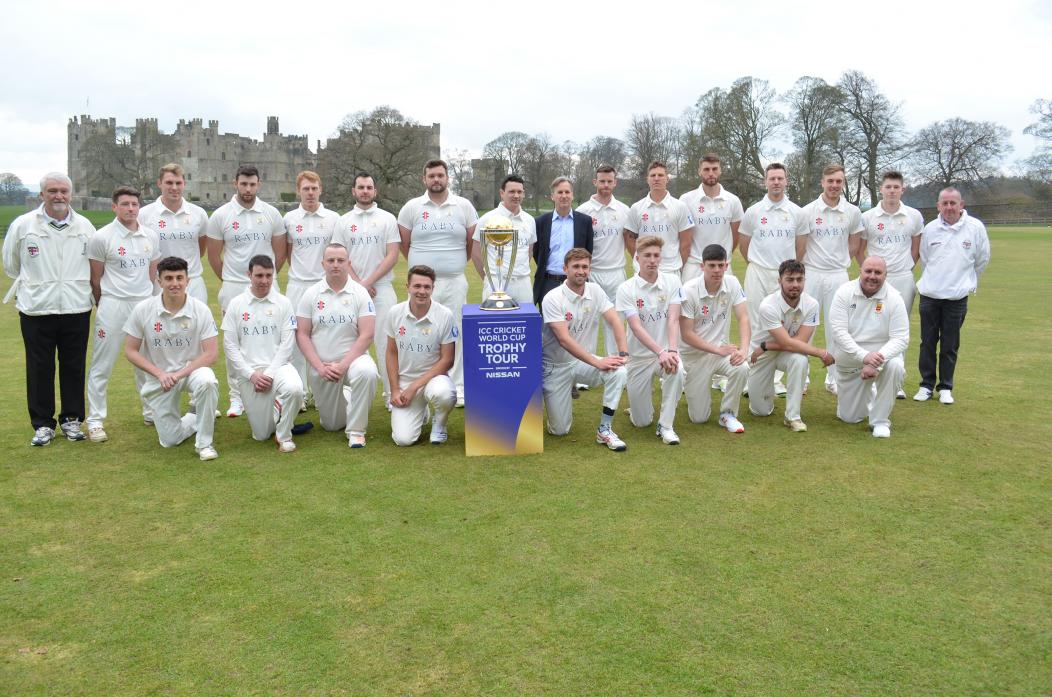 The Sir Ian Botham XI, to the left of the trophy and a Durham CCC XI played out a 100-ball challenge match to coincide with the visit to Raby Castle of the Cricket World Cup. Pictured with the teams and umpires is Lord Barnard.