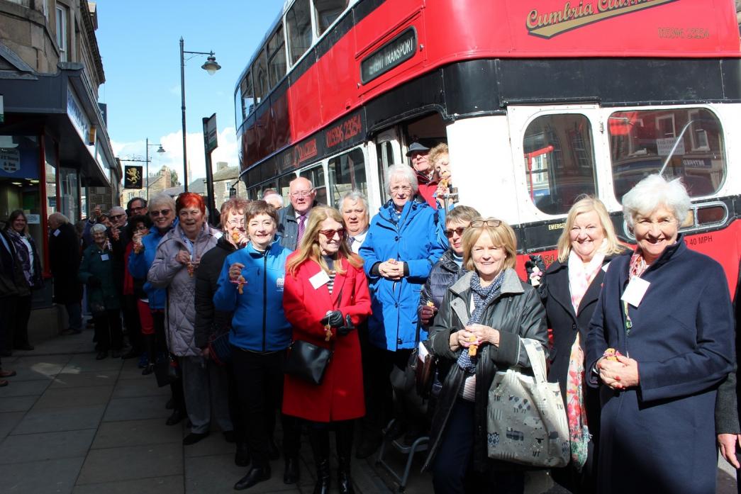 Mayors from across the region leave Peter, a 1955 bus.