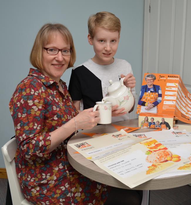 Ethan Fletcher and mum Debbie prepare for Good Friday’s coffee morning at Mickleton