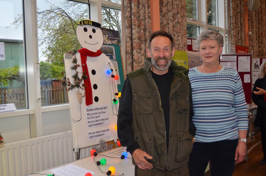 VILLAGE APPEAL: Volunteers Paul Benson and Lindsey Pepall are looking for more residents to help put up and take down the village Christmas lights