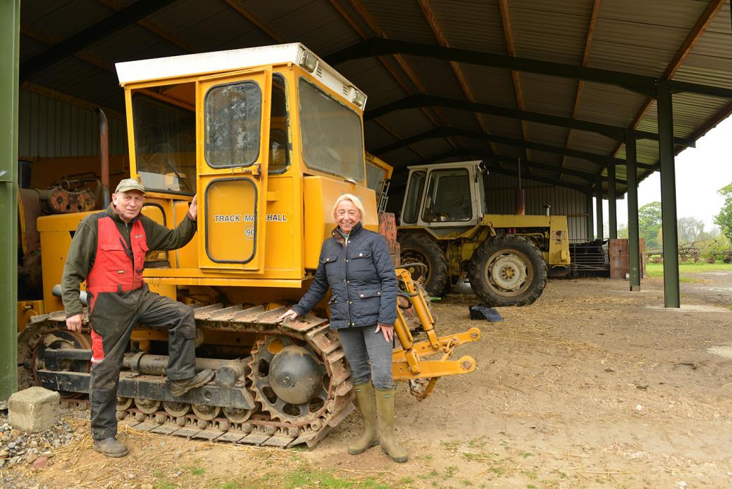 WAR HISTORY: Peter and Ann Moss with one of their vintage crawler tractors that will go under the hammer during an auction at Ewebank farmer later this month