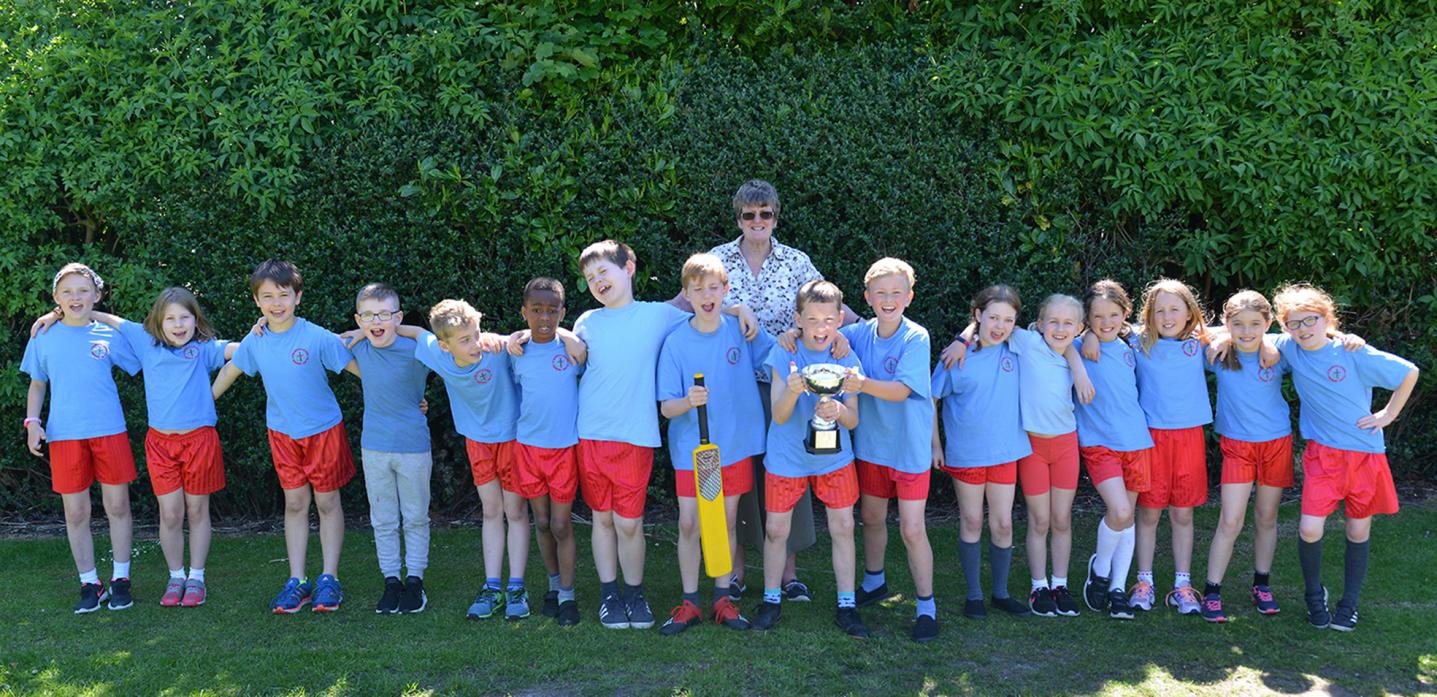 BOWLED OVER: Cricketers from St Mary's Primary School with the Staindrop School Cluster winners trophy they earned during a recent tournament