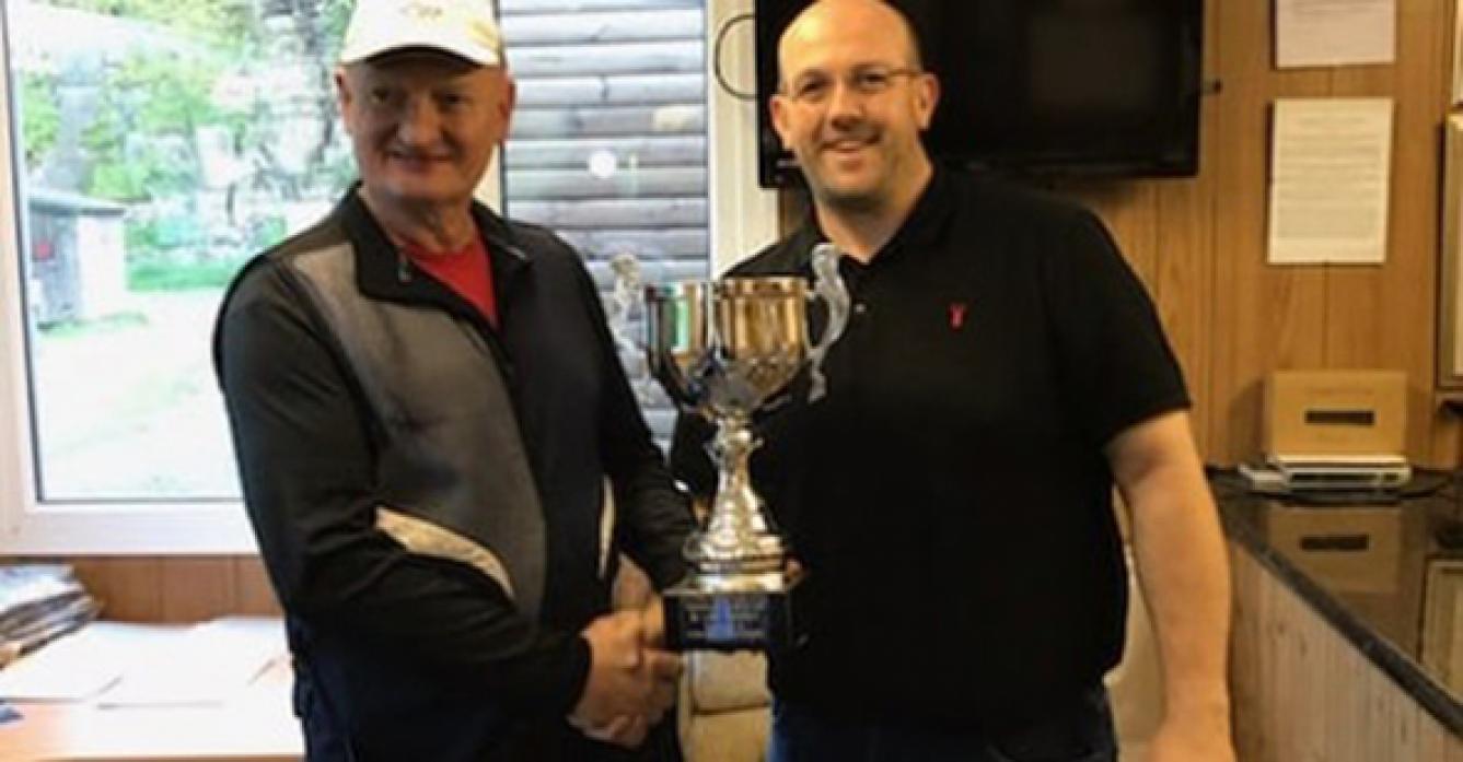 COMPETITION WINNERS: Peter Johnson receives his trophy from Steve Corner.