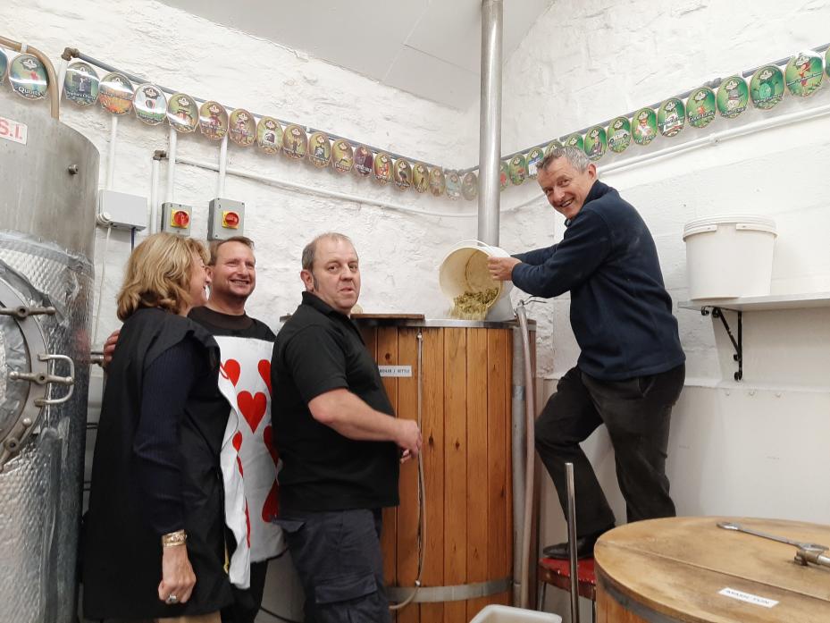 DRINK ME: Peter Montgomery adds the hops watched by Christine Gibson-Bell and Peter Cockerill, from the Castle Players, and supervised by Peter Fenwick, of Mithril Ales