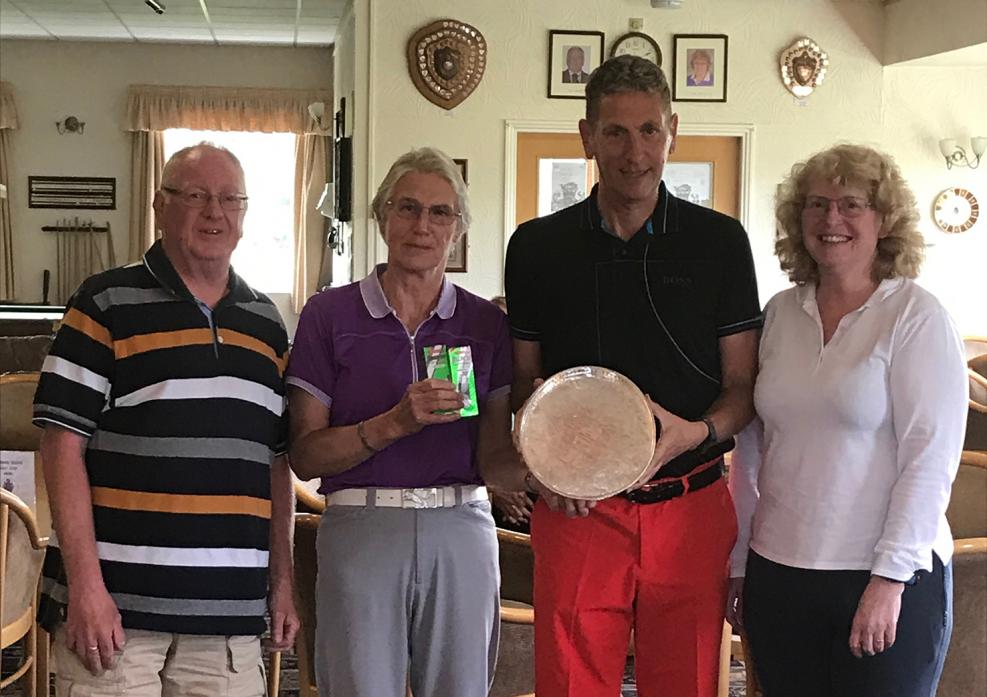WINNERS: Phil Ball holds the Ball Trophy, which he won with partner Barbara Yorke. They are flanked by ladies captain Joy Pallister and club captain Ross Law