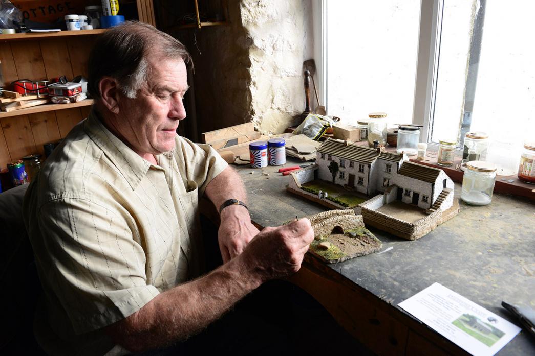 GETTING CREATIVE: Trevor Dixon in his workshop where he produces miniature models. Mr Dixon will lead sessions of the new Creative Age project at Utass