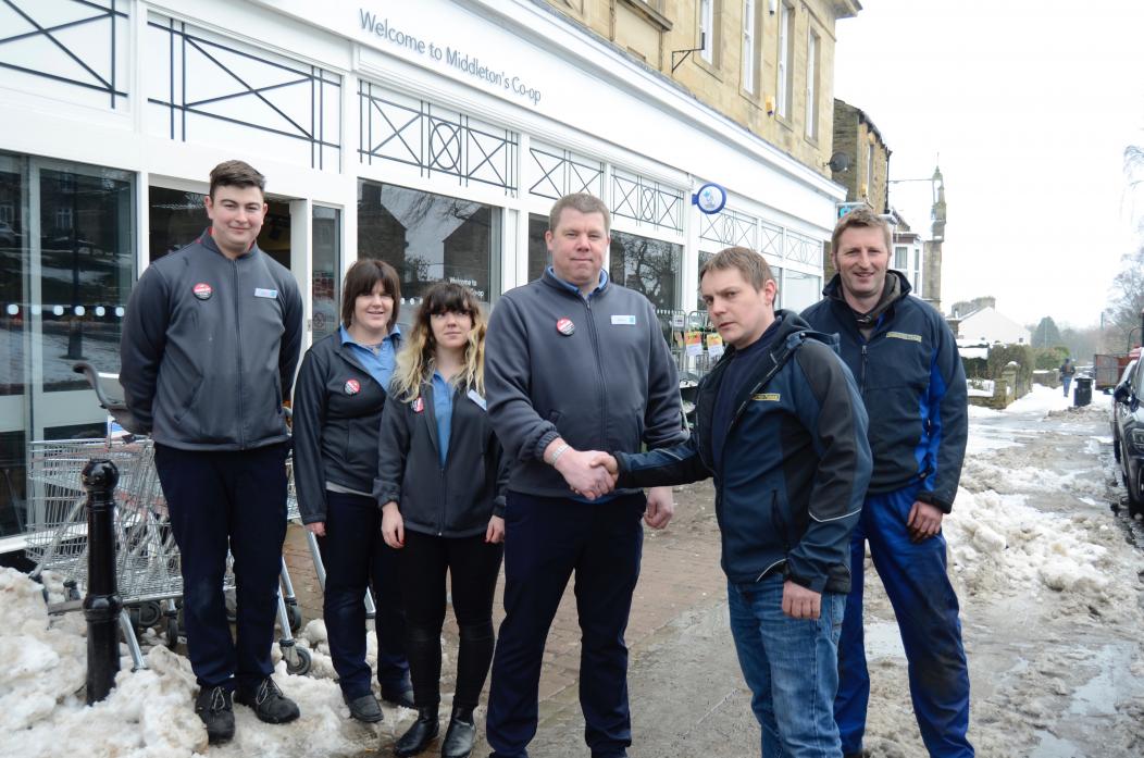 THANK YOU: Shaun McGrath, manager of Middleton-in-Teesdale Co-op, shakes hands with Scott Wallace, from Middleton Forge, as Co-op staff Luke Hodson, Vicki Tarn and Ali Collinson look on with Forge driver Martin Robinson