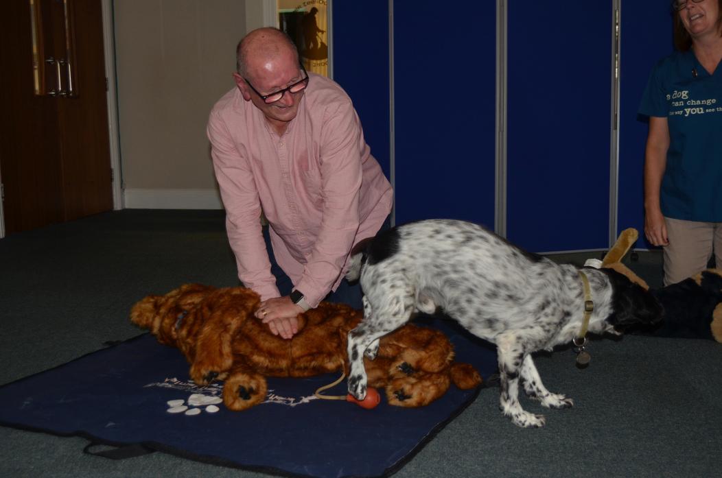 VITAL SKILLS: Gordon Jones tried his hand at CPR on model Jerry, assisted by his own dog, Barney
