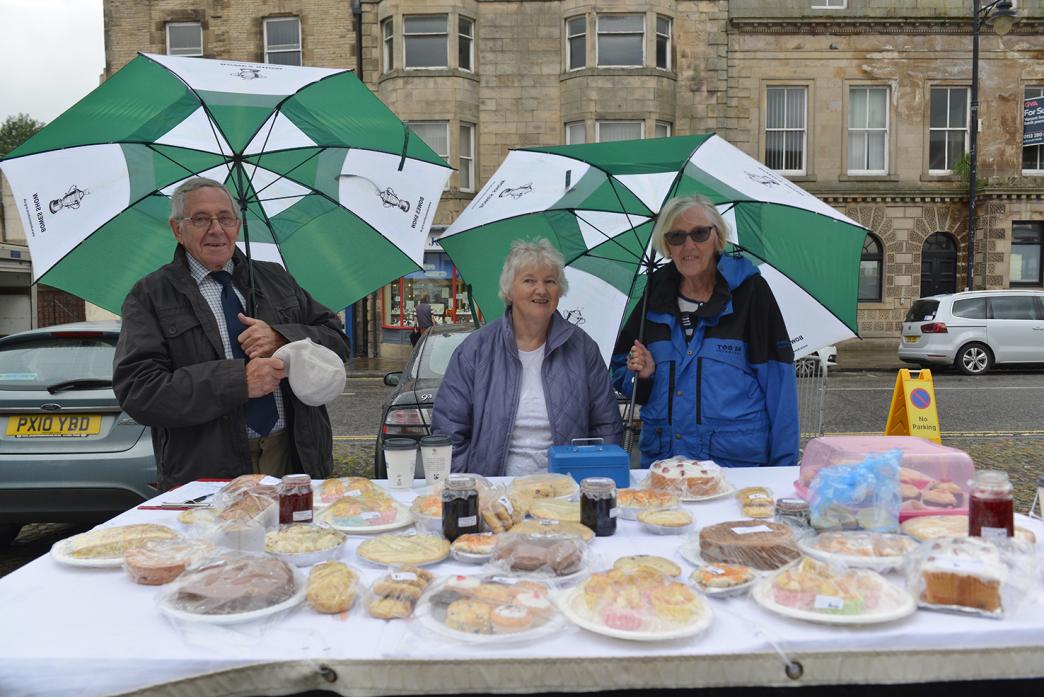 RAISING FUNDS: Andrew and Christine Bracewell with June Addison, centre, at the Bowes Show stand at the Wednesday market in Barnard Castle last week