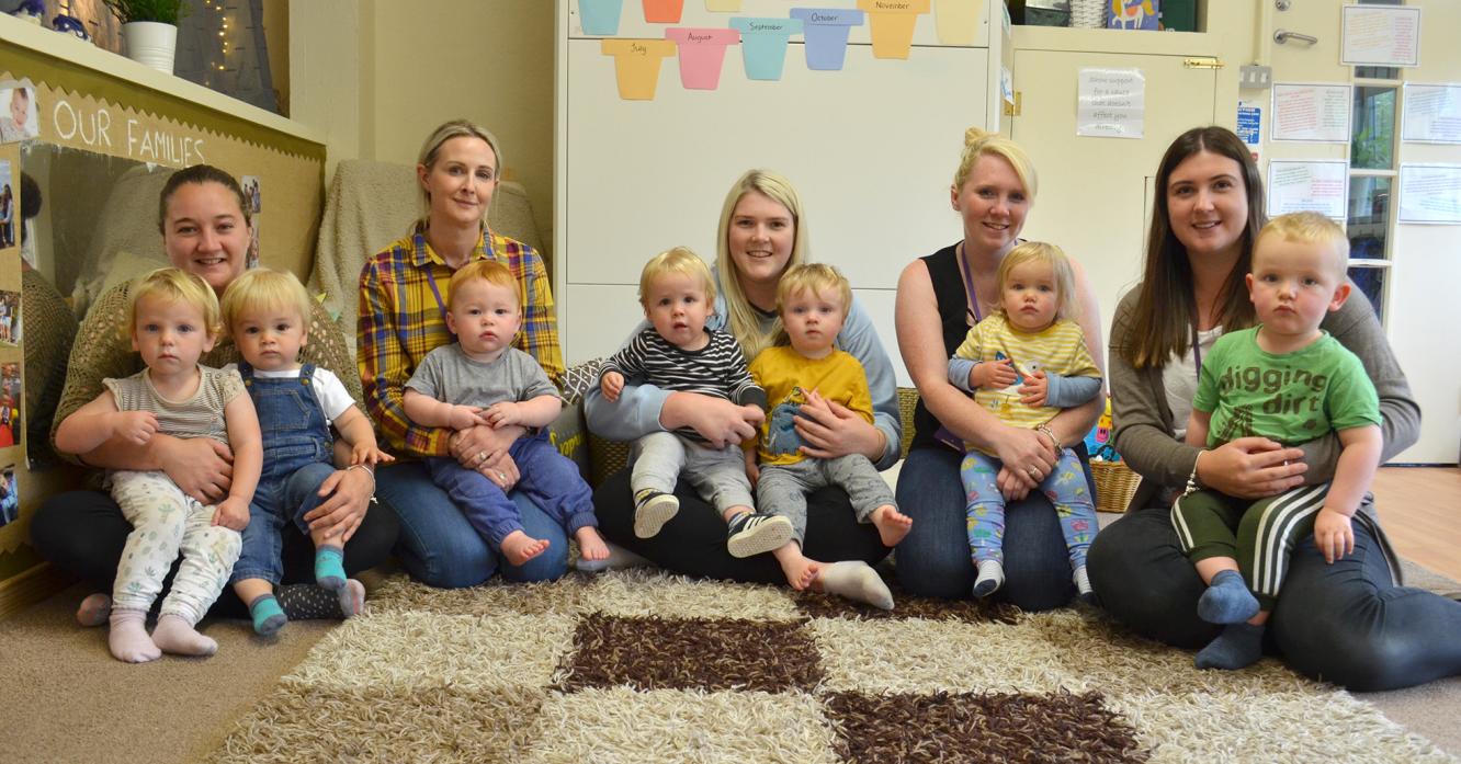DOUBLE LIFE: When not one of the top female darts players in the world, Kirstie Hutchinson works as a child care practitioner. She is pictured, centre with colleagues Christianne Tarn, Melanie Mitchell, Lauren McGarr and Sophie Gipps at Green Lane Nursery