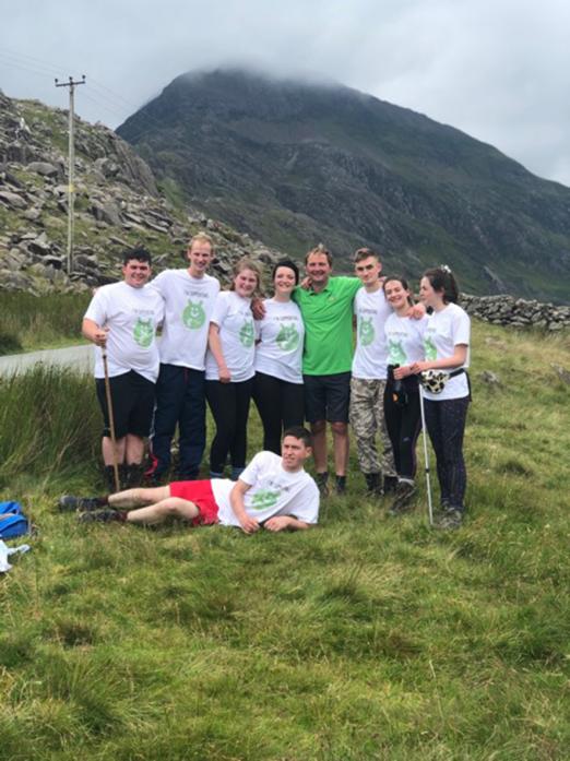 TOP EFFORT: Barnard Castle Young Farmers Tom Addison, Molly Griffin Zoe Hutchinson, Danny Souter, William Beadle, Helen Bell, Anna Pounder and Andrew Dent with driver Stuart Robson after completing their three peaks challenge
