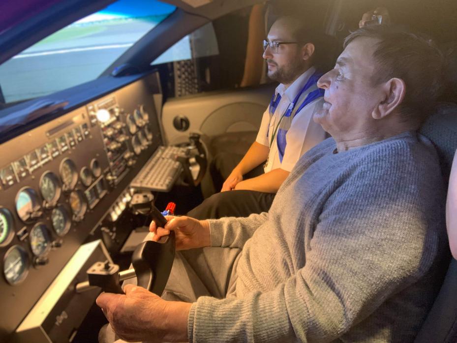 PILOT’S SEAT: Joe Robson flying the plane