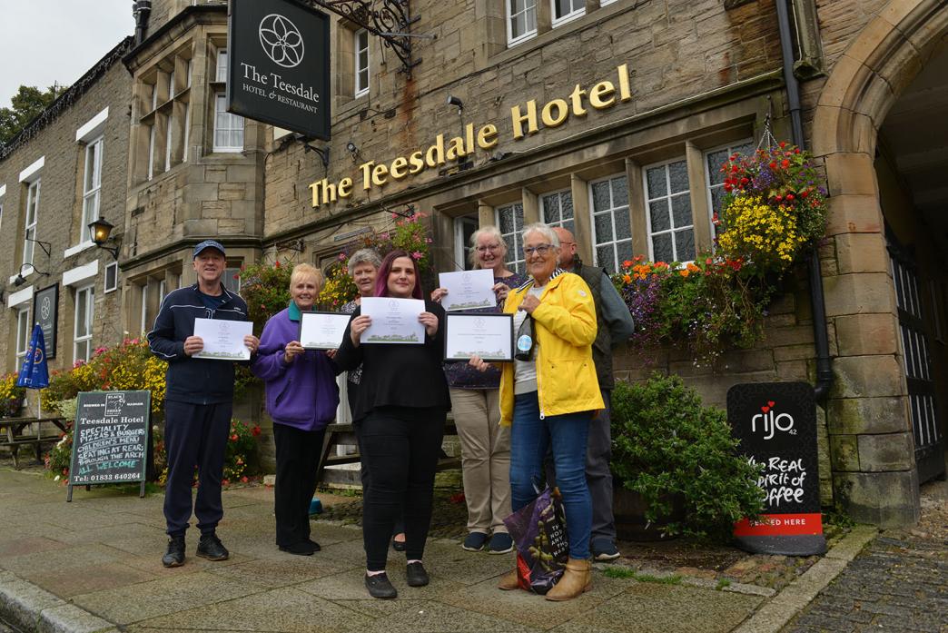 WELL DONE: Aidan Peoples, Jo Lee, Lindsey Pepall, Jessie Bowe, Jill and Alan Savage and Pam Phillips with the  multiple awards won by Middleton-in-Teesdale during the Northum-bria-in-Bloom contest                       TM pic
