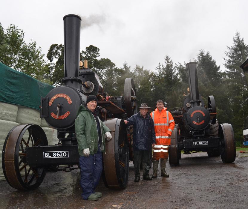 RAINED OUT: Stephen Keaton with his son Robert,  right, and host Peter Moss will have to wait a little longer to try ploughing with the mighty twin John Fowler engines                                     TM pic