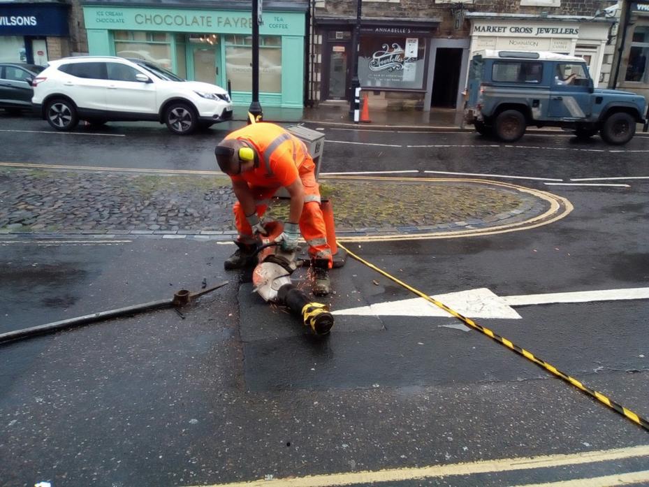 DAMAGED: Durham County Council employee Stephen Hill removes the bollard