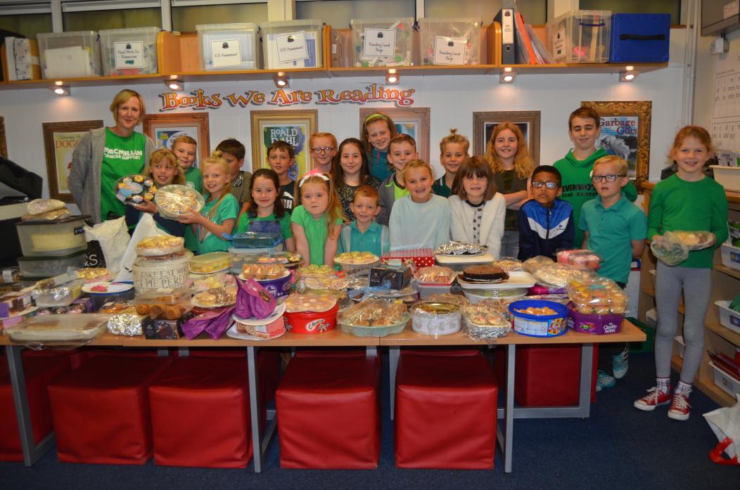 TUCK IN: Members of Staindrop Primary School’s student council with the packed table of home-baked cakes ready for their coffee morning