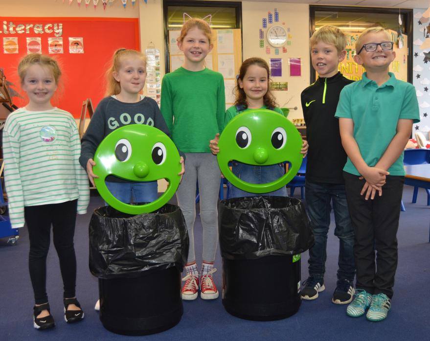 SMILEY FACES: Children from Staindrop, from left, Annabelle, Ella, Millie, Sophie, Toren and Henry, with the bins