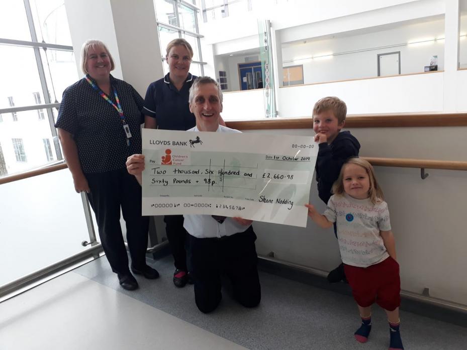 BIG EFFORT: Royal Victoria Infirmary clerk Debbie Balmer, nurse Emma Castonguay and Prof Simon Bailey receive a cheque from cancer surviver Shane Nodding and his sister Abbie