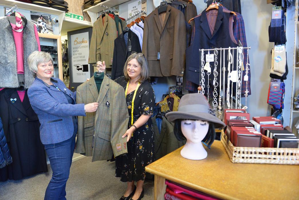 DEMENTIA EVENT: Lions president Sharon Walker and outfitter Fiona Brookes examine some of the items that will form part of a charity fashion show later this month
