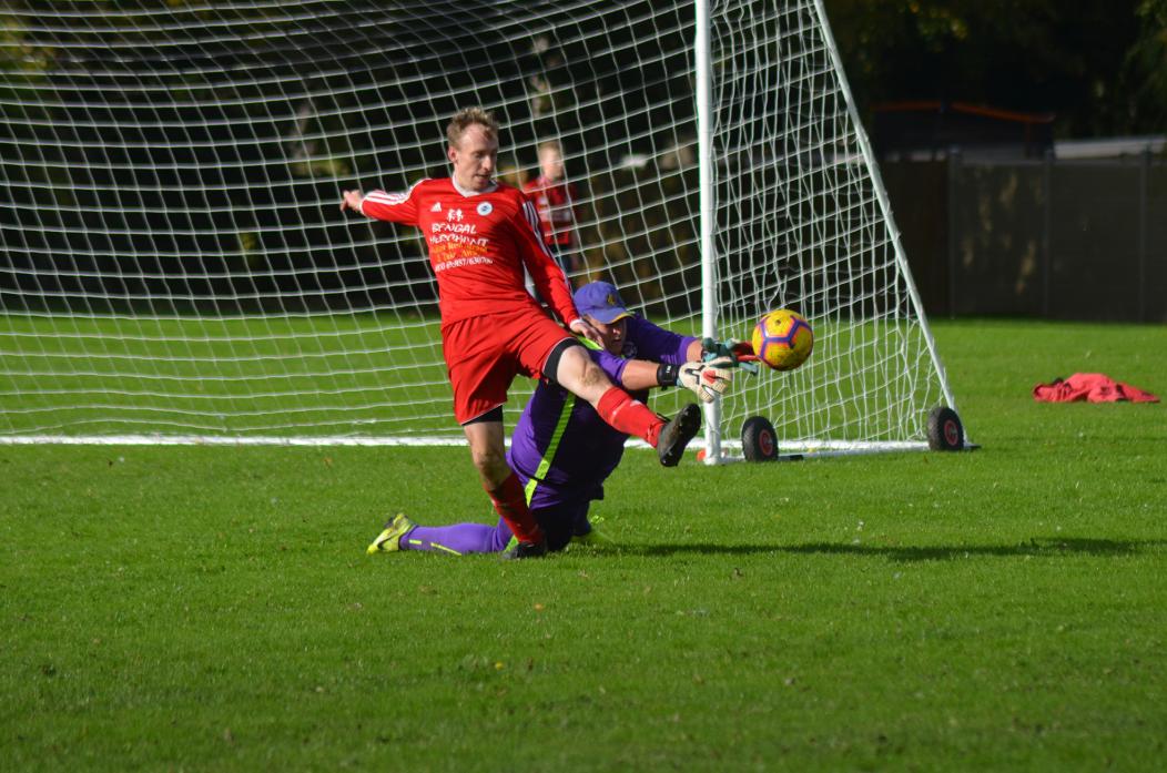 CUP WIN: Bowes striker Rob Dixon, who scored his side’s third goal, is foiled by the Shildon keeper on this occasion