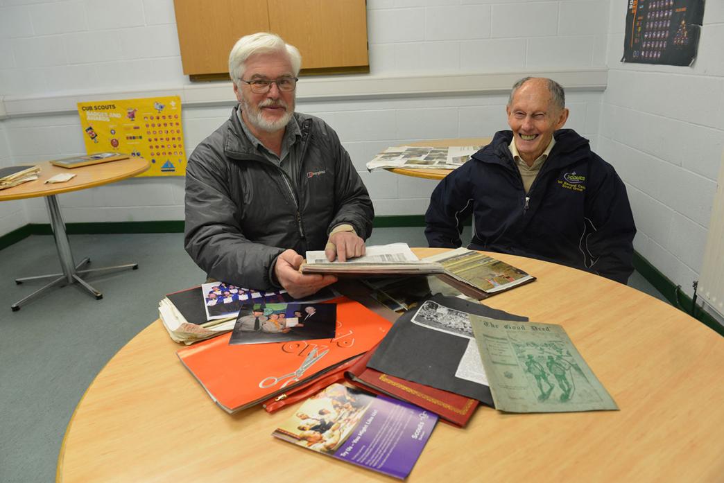 LONG HISTORY: Chairman Colin Clarke and treasurer David Williams browse through old photographs, newspaper clippings and memorabilia relating to the 1st Barnard Castle Scouts
