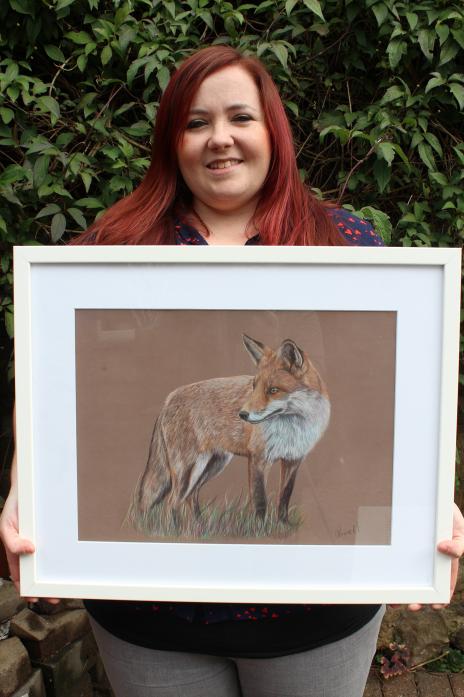 STUNNING DETAILS: Laura Pennell with one of her detailed animal portraits