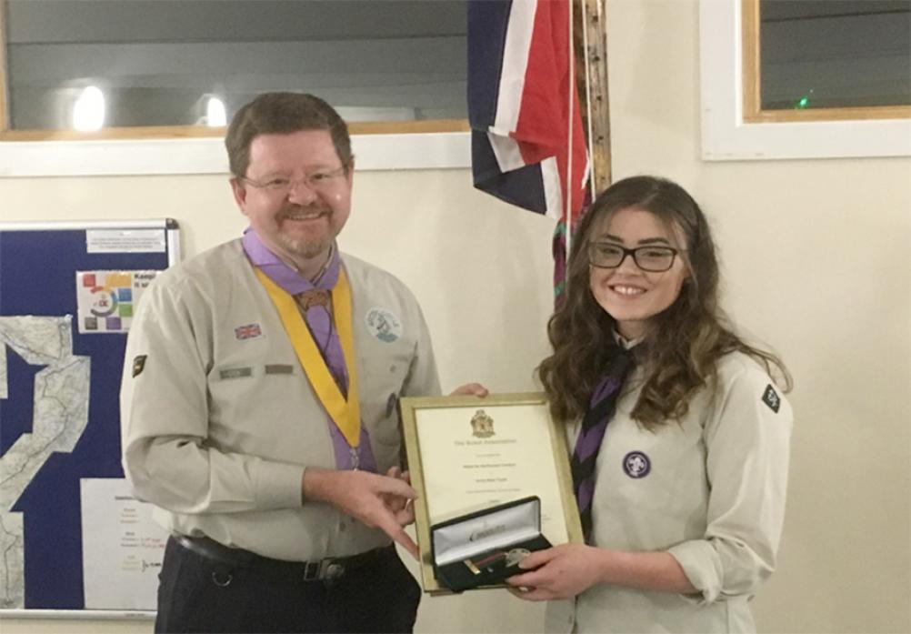 SELFLESS: Staindrop Explorer Scout Annie Taylor receives her Medal for Meritorious Conduct from David Stokes