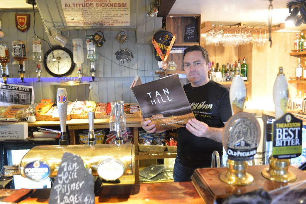 GOOD READ: Andrew Hields with the new illustrated coffee table book about Tan Hill Inn