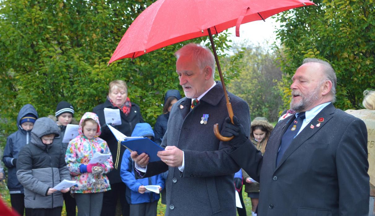 SOLEMN OCCASION: The remembrance service at Evenwood was led by Sandy Gall, left, pastor of the Cornerstone Christian Centre, pictured with resident Ernie Malt