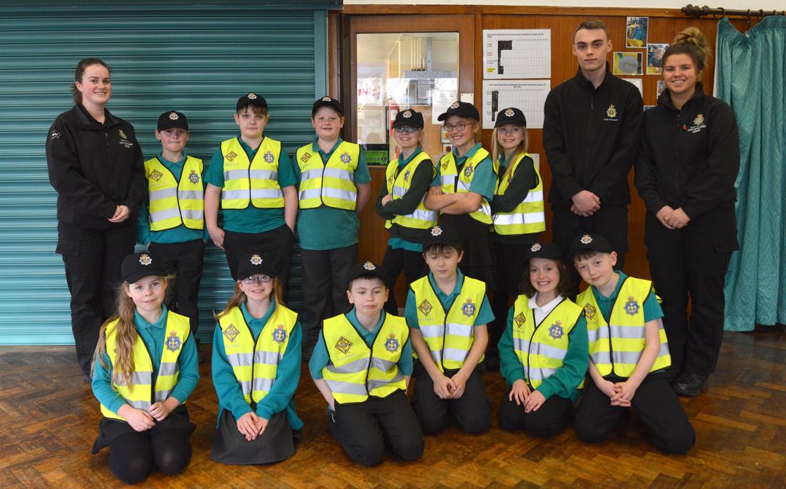 HELLO, HELLO: Youth development workers Emily Snowball, Joe Boucher and Alex Wardman with Gainford Primary School’s mini police squad