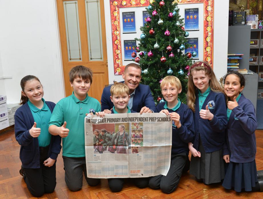 SCHOOL TABLES: Staindrop headteacher Steve Whelerton and pupils Lily Bland, Josh Fear, Daniel Robertson, William Poole, Jennifer Turnbull and Padma Nair enjoyed an early present when they learned their school is in the top 250 in the country    TM pic