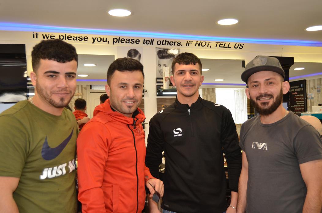 TOWN BUSINESS: Barbers Dara Omer, Kaywan Abdulah, Hardi Toueeq and Harem Mohamed are hoping to do a brisk trade to raise funds for charity 											    TM pic